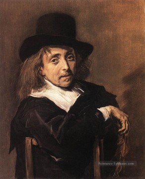  Assis Tableaux - Homme assis tenant un portrait de branche Siècle d’or néerlandais Frans Hals